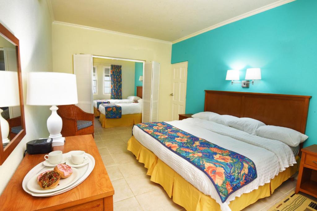 Postel nebo postele na pokoji v ubytování Blue Orchids Beach Hotel