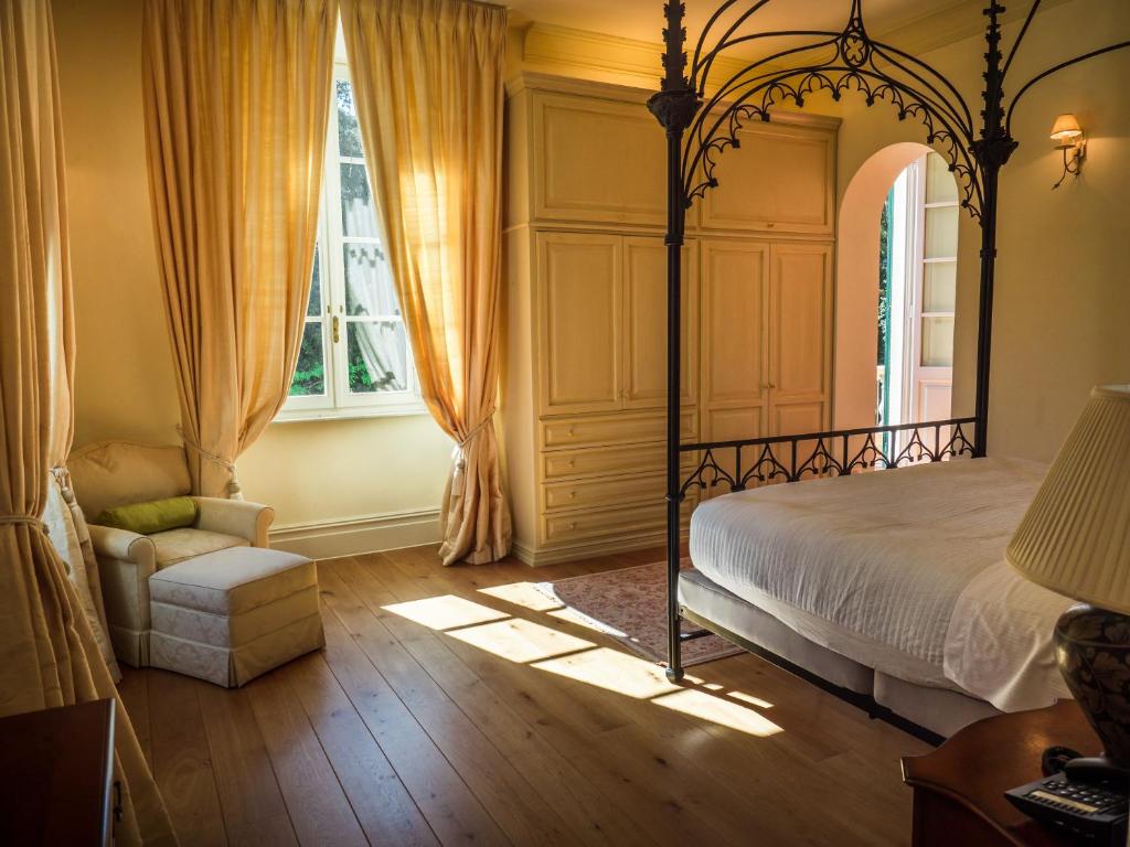 Tempat tidur dalam kamar di Hotel Villa Casanova
