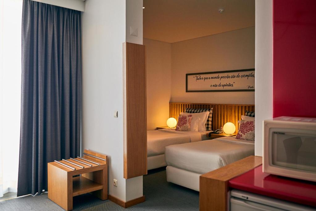 Кровать или кровати в номере Hotel Praia Marina by RIDAN Hotels