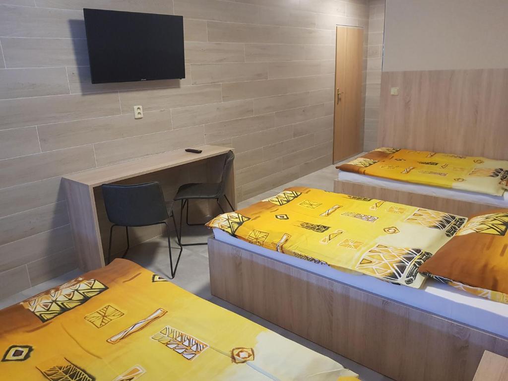 Postel nebo postele na pokoji v ubytování Penzion Hudebka
