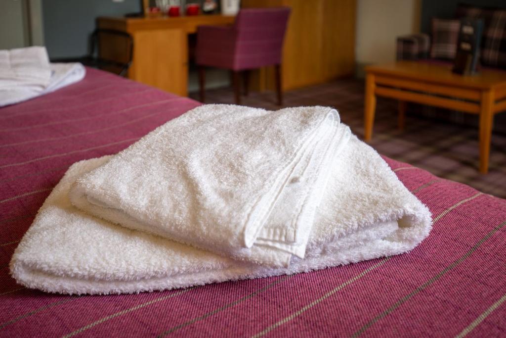 Woodthorpe Hotel房間的床