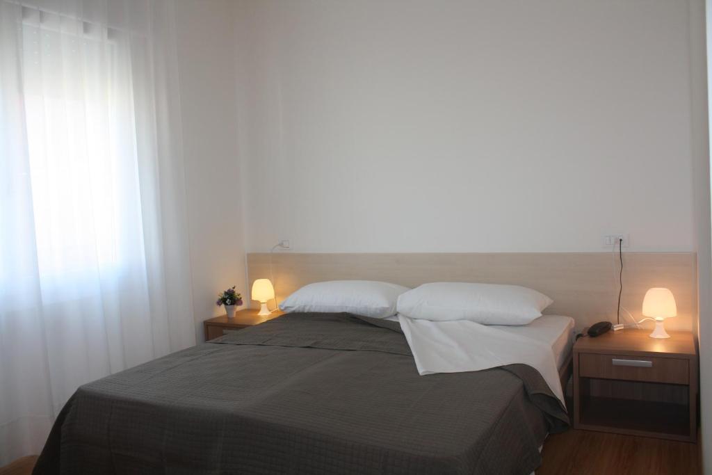Postel nebo postele na pokoji v ubytování Hotel Gronda Lagunare