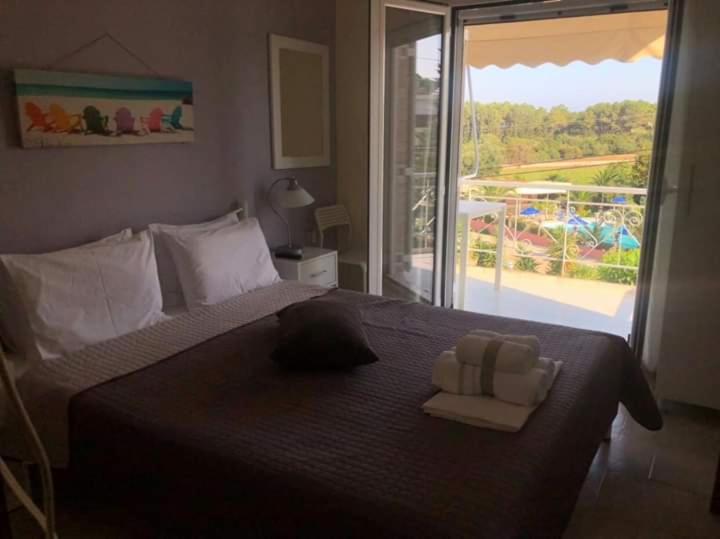 Postel nebo postele na pokoji v ubytování GIOTA ROOMS