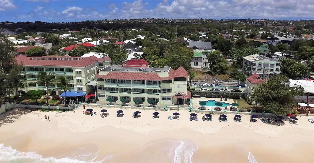 an aerial view of a resort on the beach at Coral Mist Beach Hotel in Bridgetown
