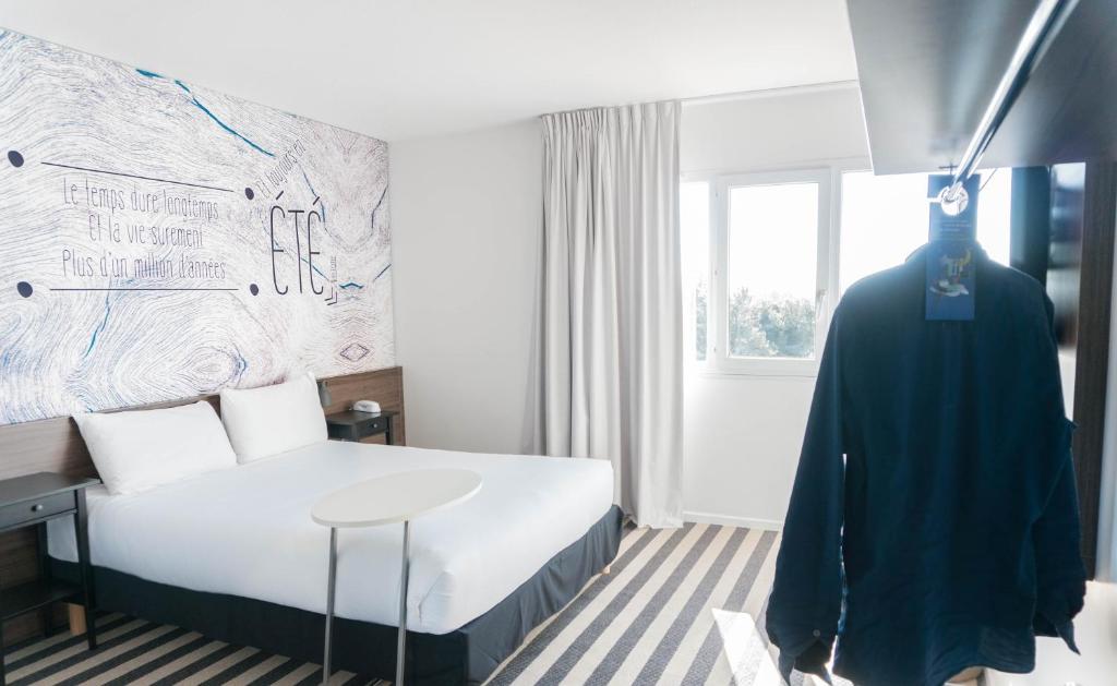 Postel nebo postele na pokoji v ubytování ibis Styles Perpignan Canet En Roussillon