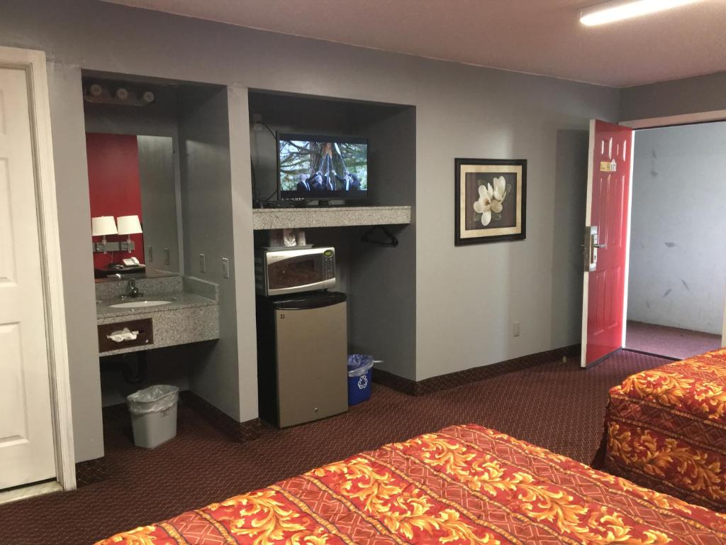 TV a/nebo společenská místnost v ubytování Haven Inn & Suites