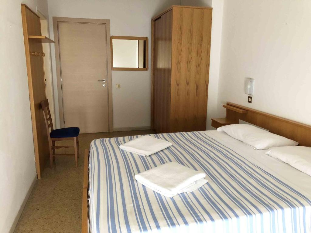 Postel nebo postele na pokoji v ubytování Hotel Adriatico