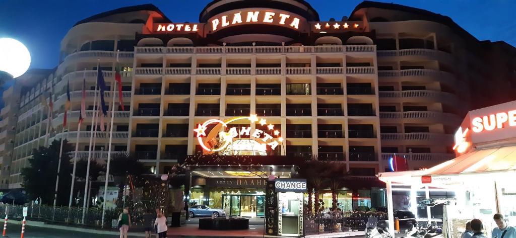 a hotel with a sign on the front of it at Miramar Palace - Planeta Apartamenty 614A, 614S in Sunny Beach