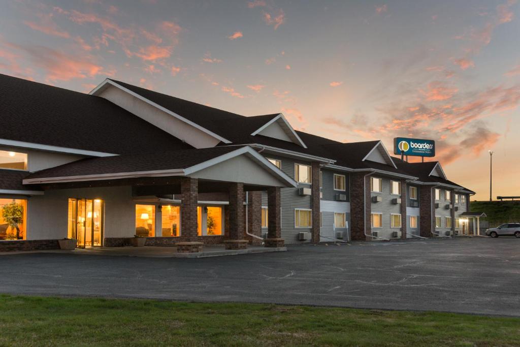 a rendering of a hotel with a parking lot at Boarders Inn & Suites by Cobblestone Hotels - Superior/Duluth in Superior