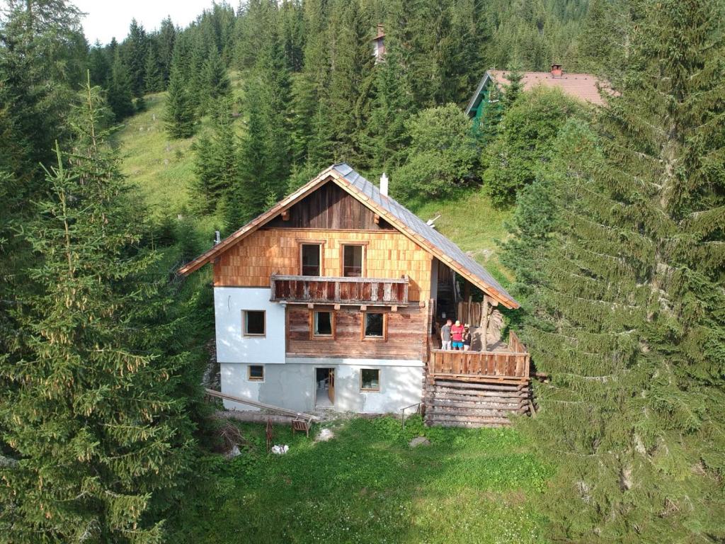 a wooden house in the middle of a forest at Ferienhaus Flattnitz in Flattnitz