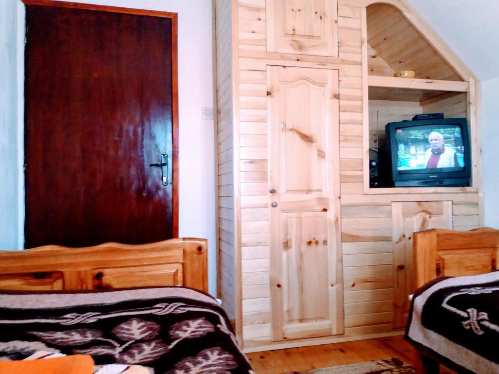 Postel nebo postele na pokoji v ubytování Apartments And Rooms Gold