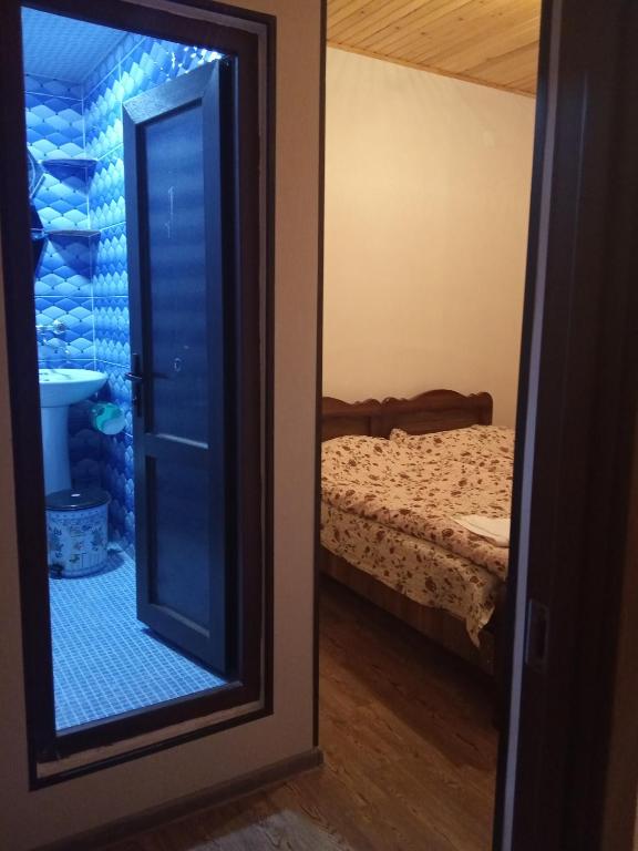 Postel nebo postele na pokoji v ubytování Guest House Tavaduri