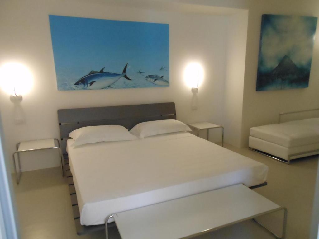 Postel nebo postele na pokoji v ubytování Portopalosuite