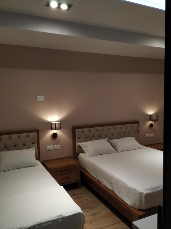 Postel nebo postele na pokoji v ubytování Hotel Pelikan