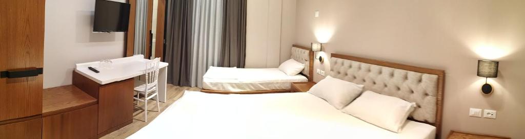 Postel nebo postele na pokoji v ubytování Hotel Pelikan