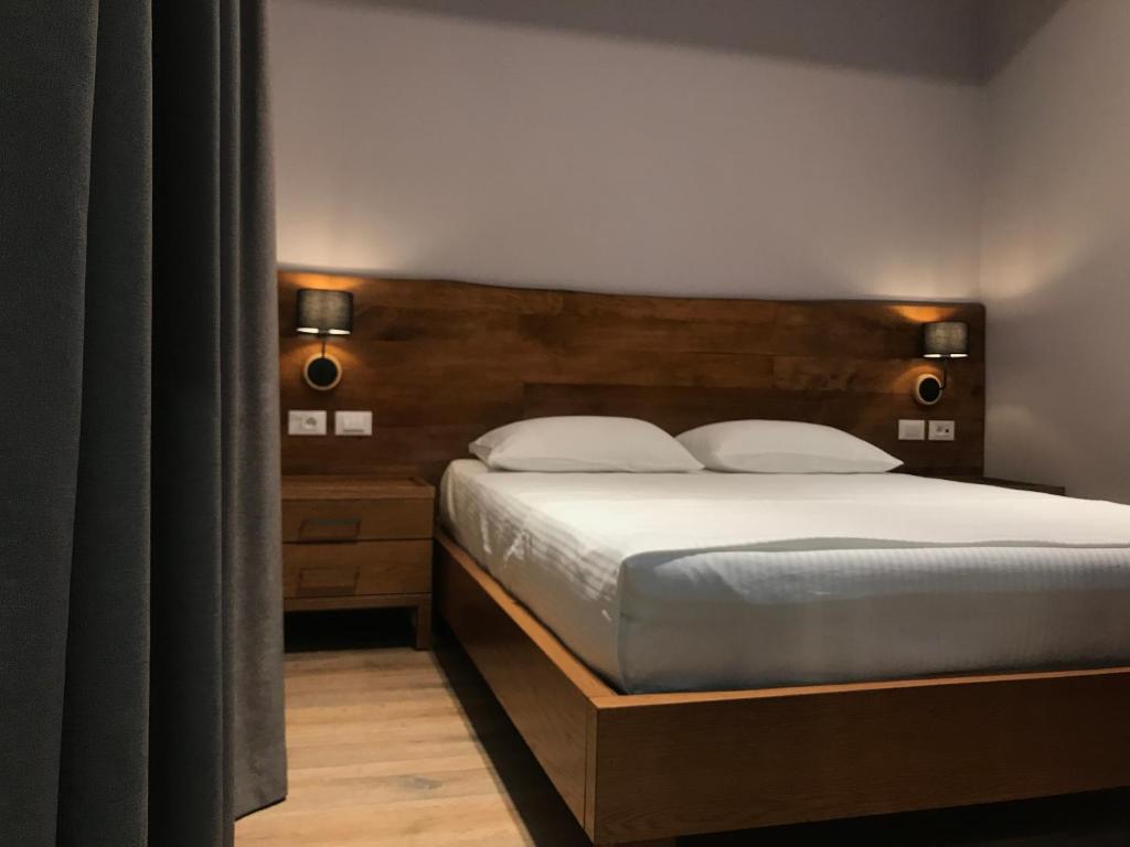 Postel nebo postele na pokoji v ubytování Hotel Pelikan