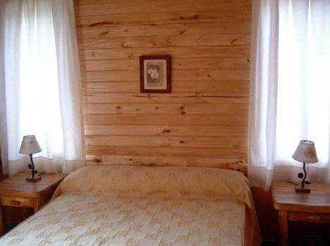 Postel nebo postele na pokoji v ubytování Cabañas En el Corazón del Bosque