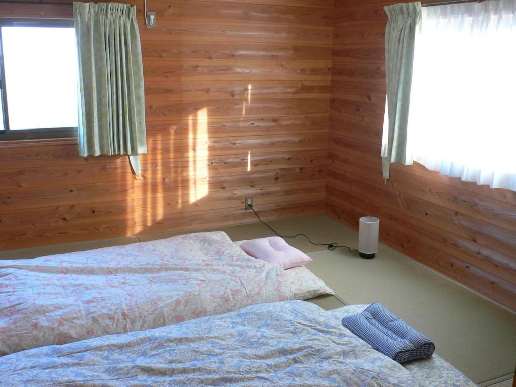 Postel nebo postele na pokoji v ubytování Guesthouse RETURN