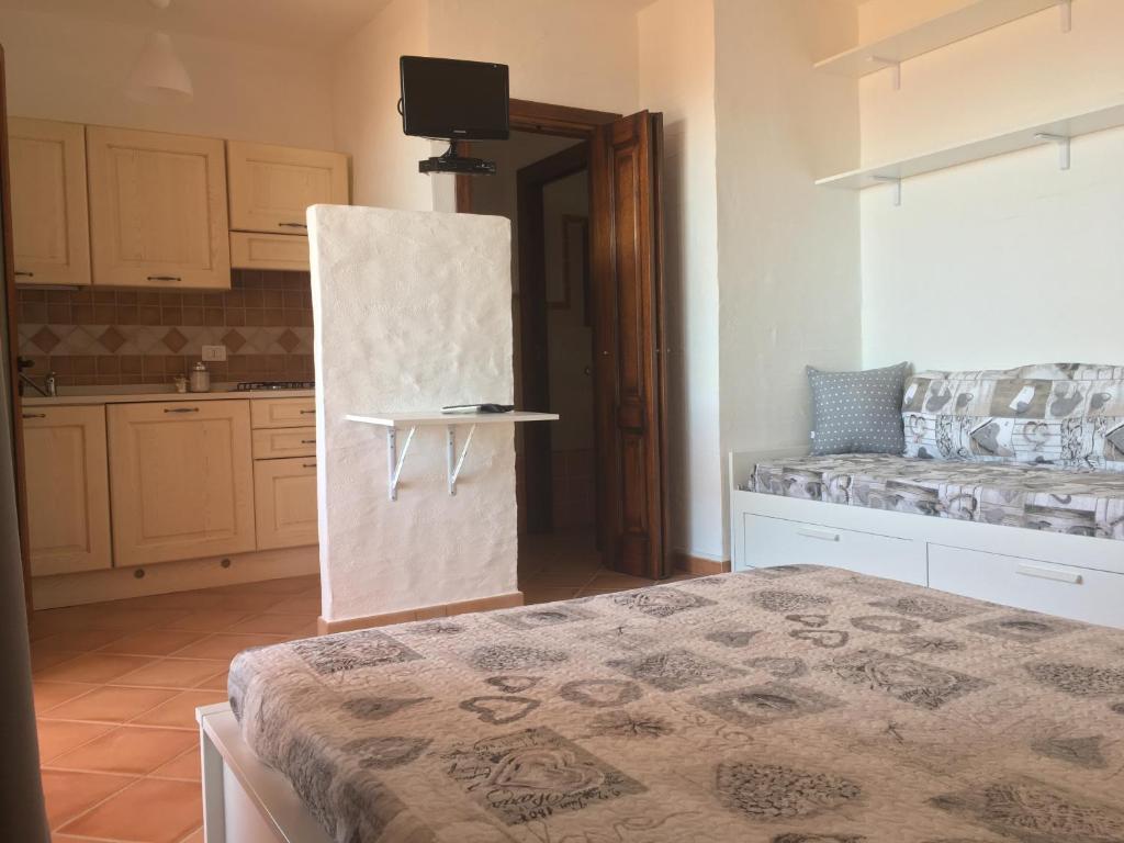 Postel nebo postele na pokoji v ubytování TERRAZZA SUL MARE wifi e piscina
