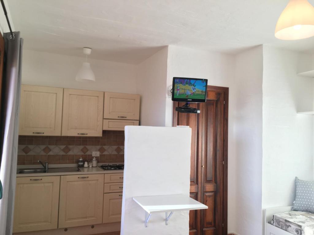 Kuchyň nebo kuchyňský kout v ubytování TERRAZZA SUL MARE wifi e piscina