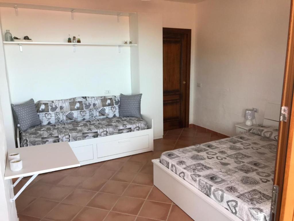 Postel nebo postele na pokoji v ubytování TERRAZZA SUL MARE wifi e piscina