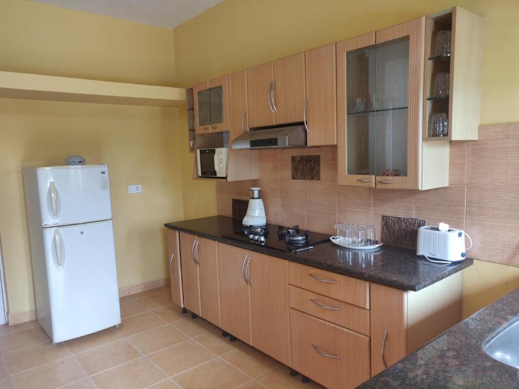 Кухня или мини-кухня в A's Holiday Beach Resort
