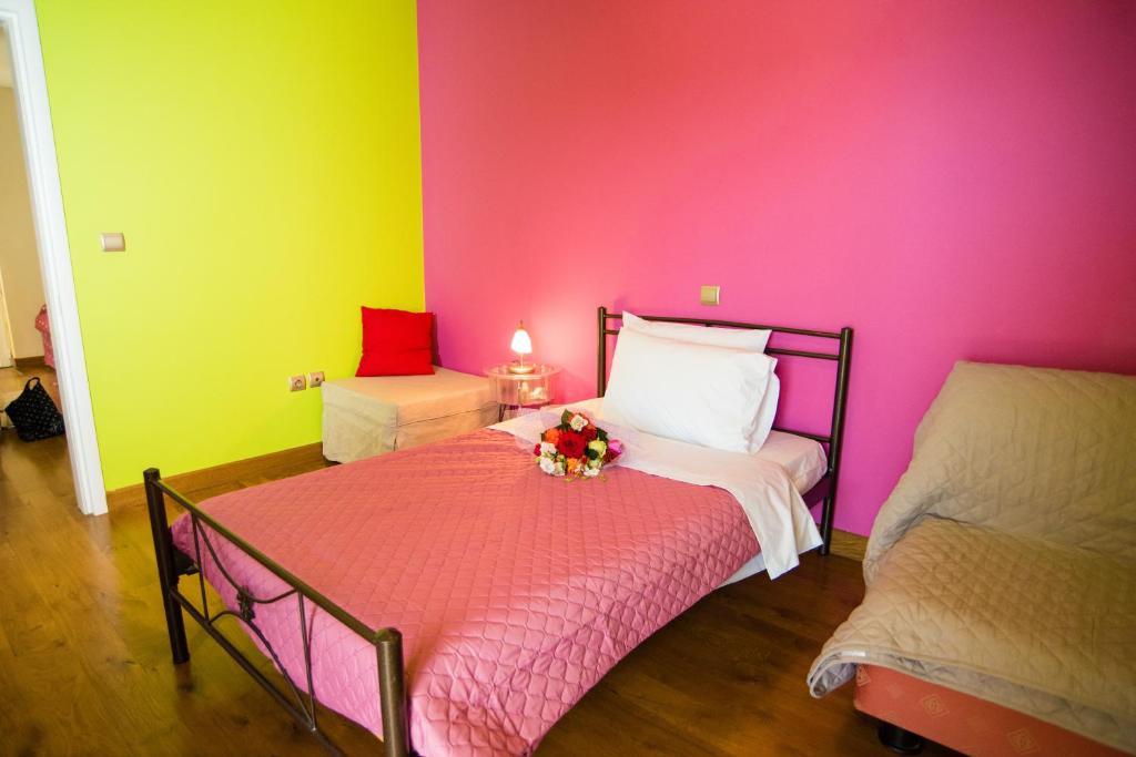 A bed or beds in a room at Villa Olympia VIP