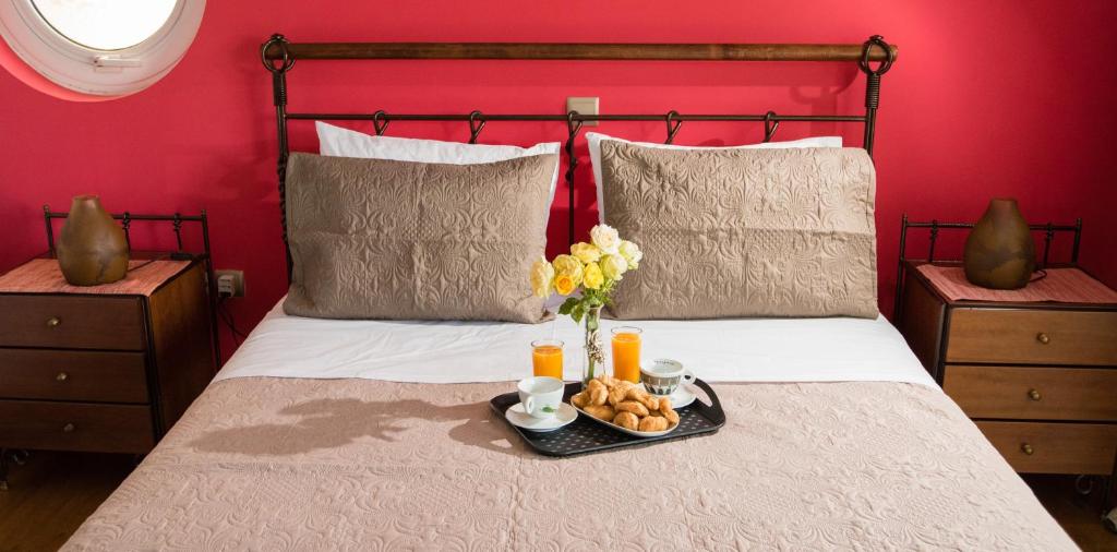 A bed or beds in a room at Villa Olympia VIP