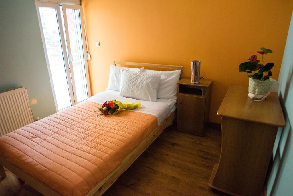 A bed or beds in a room at Villa Olympia VIP