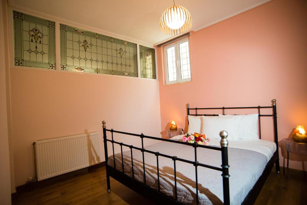 A bed or beds in a room at Villa Olympia VIP