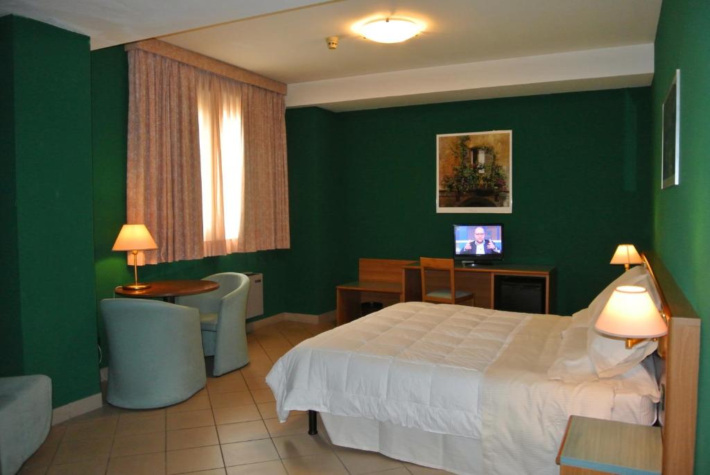Postel nebo postele na pokoji v ubytování Modo Hotel