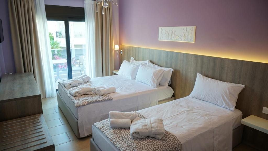 Postel nebo postele na pokoji v ubytování Agnes Deluxe Hotel