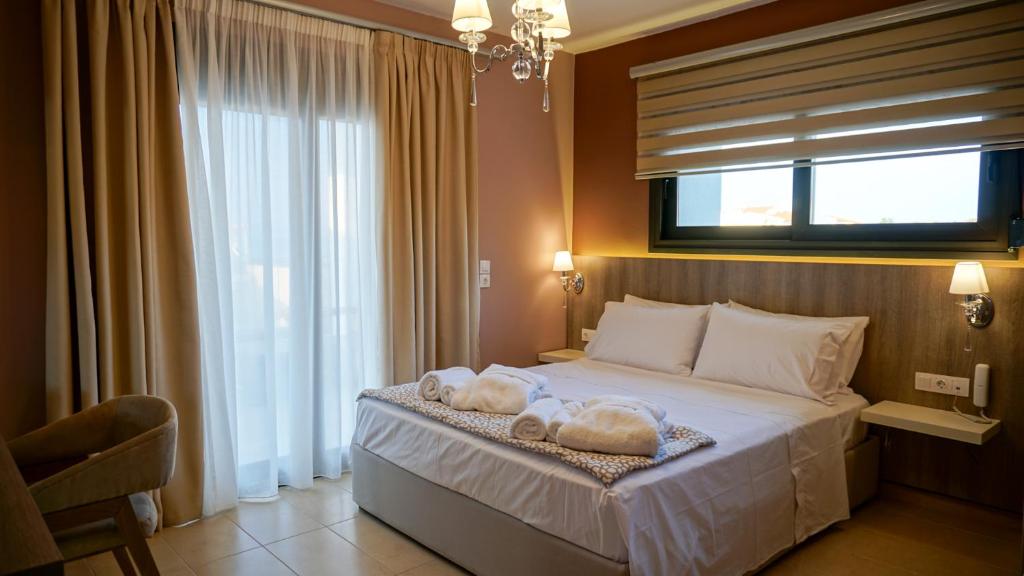 Postel nebo postele na pokoji v ubytování Agnes Deluxe Hotel