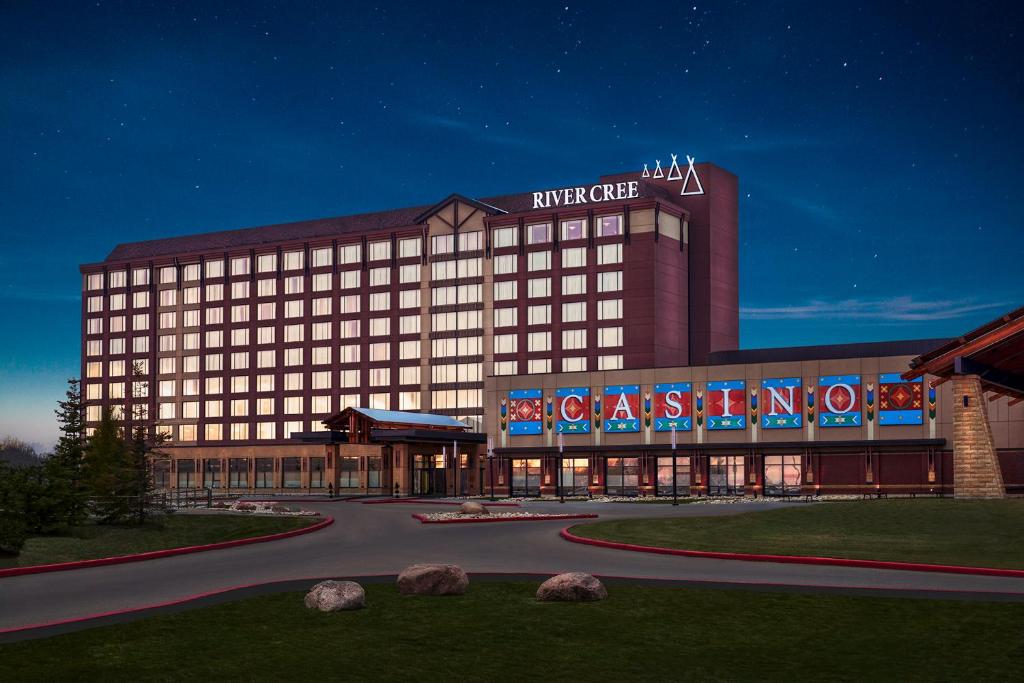 a large building with a sign on the side of it at River Cree Resort & Casino in Edmonton