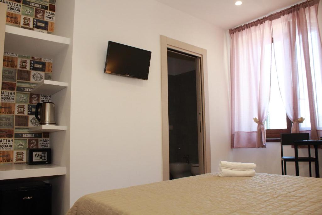 Posteľ alebo postele v izbe v ubytovaní B&B Allerìa Pozzuoli