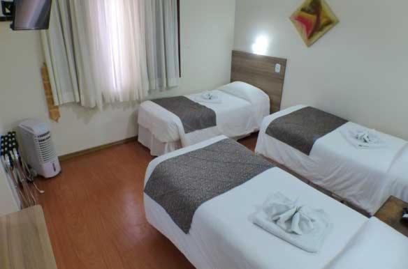 Uma cama ou camas num quarto em Hotel JB