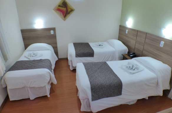 Uma cama ou camas num quarto em Hotel JB