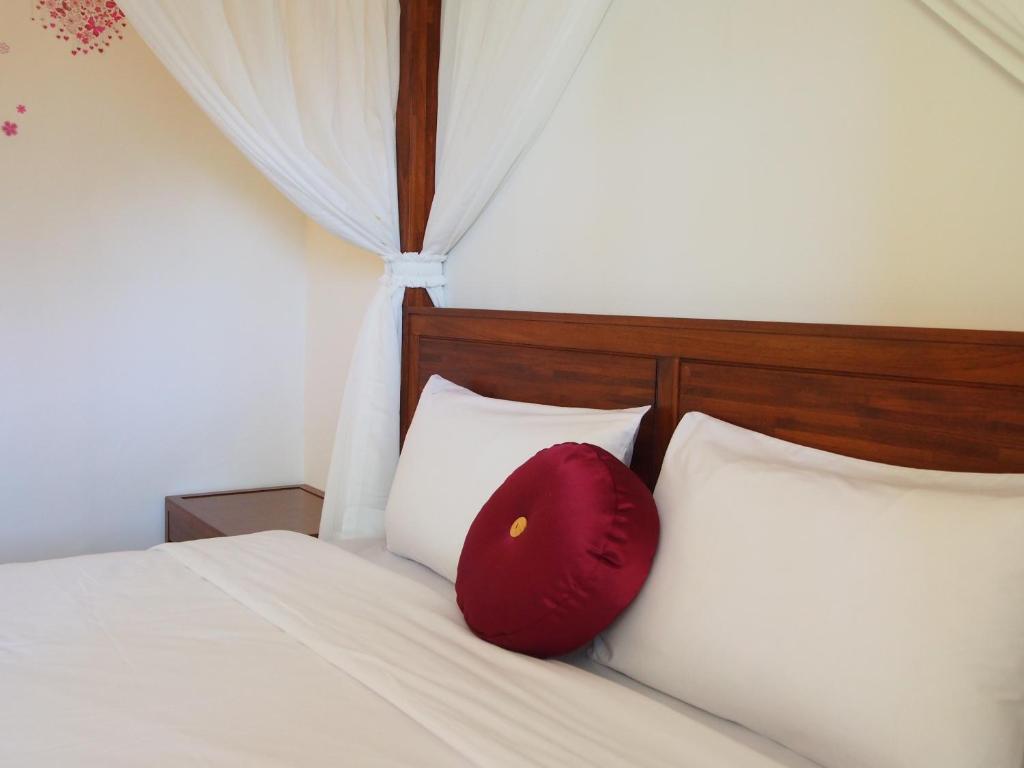 Postel nebo postele na pokoji v ubytování SunRise 23.5N B&B
