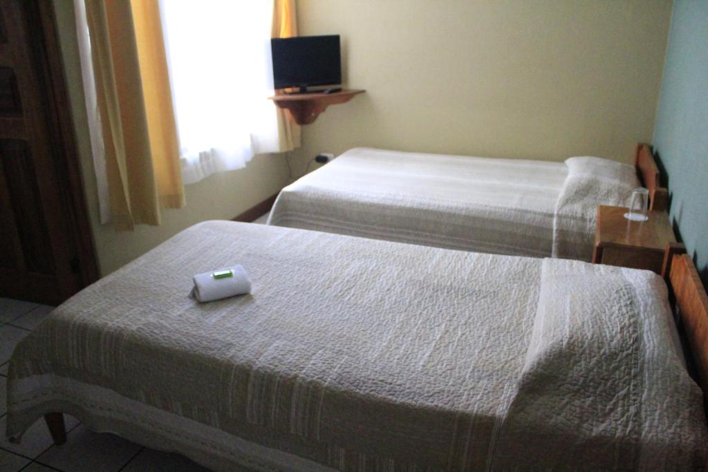 Postel nebo postele na pokoji v ubytování Hotel Guadalupe