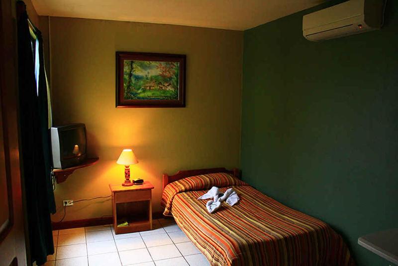 Postel nebo postele na pokoji v ubytování Hotel Guadalupe