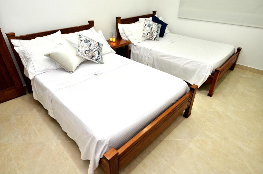 Katil atau katil-katil dalam bilik di Hotel La Gran Esquina