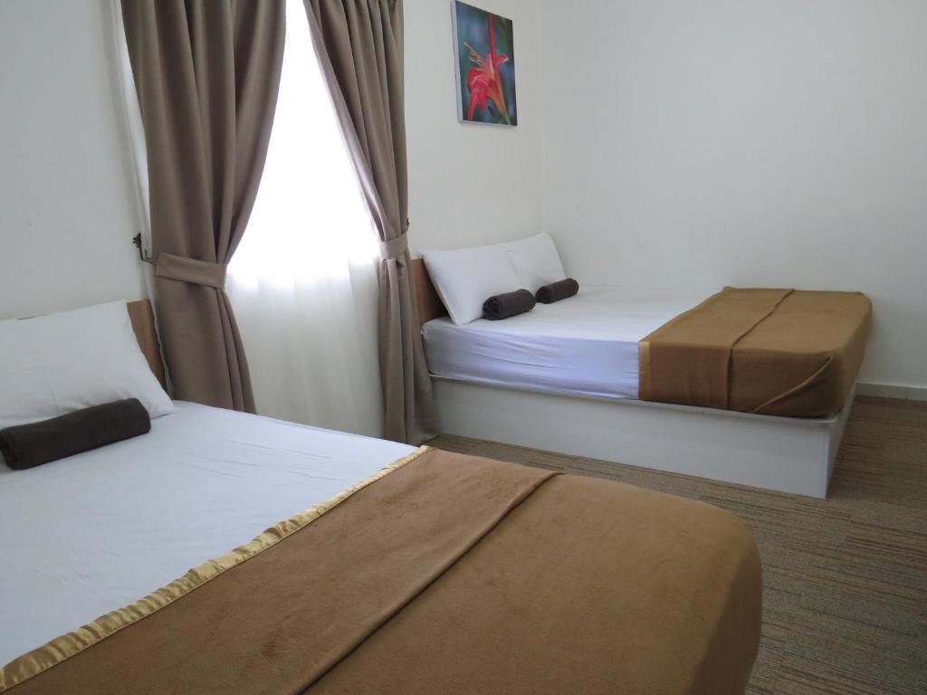 Voodi või voodid majutusasutuse Darulmakmur Chalet toas