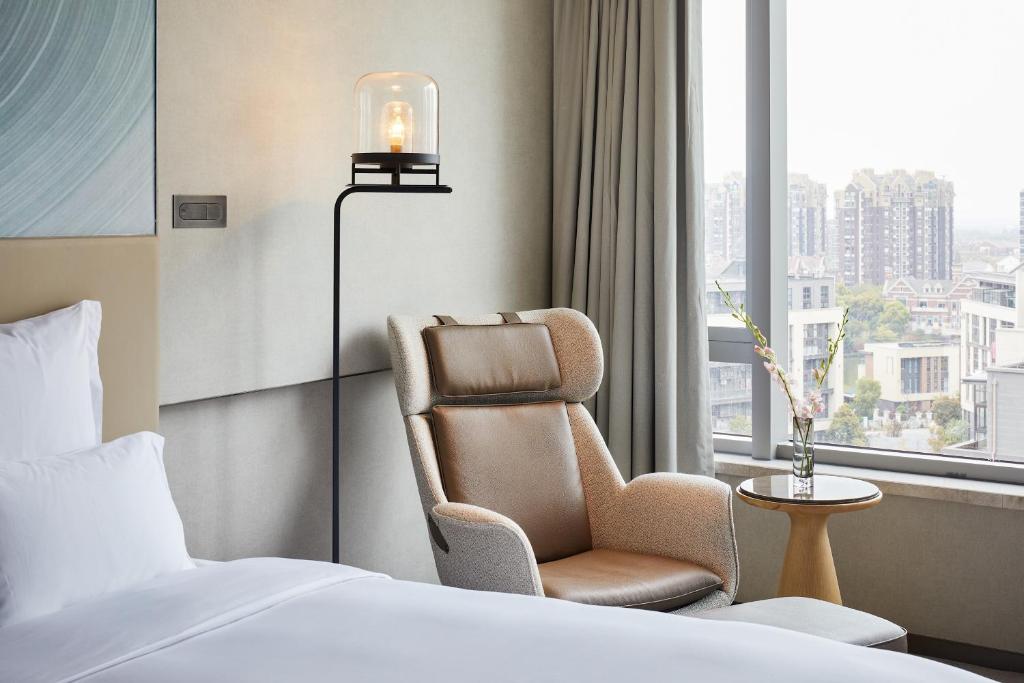 Postel nebo postele na pokoji v ubytování Pullman Shanghai Qingpu Excellence