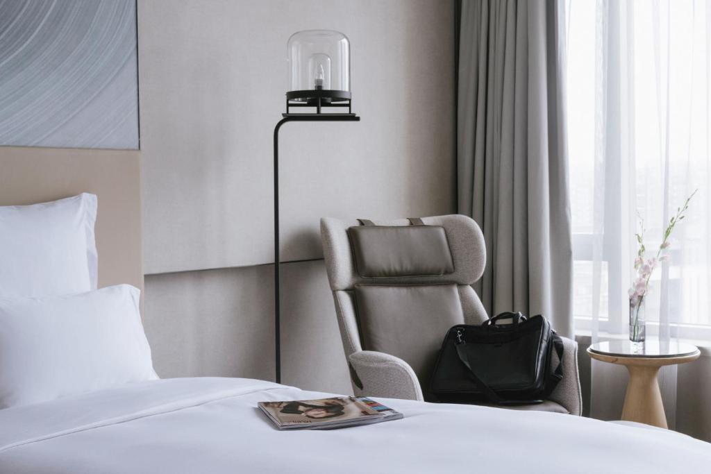 Postel nebo postele na pokoji v ubytování Pullman Shanghai Qingpu Excellence
