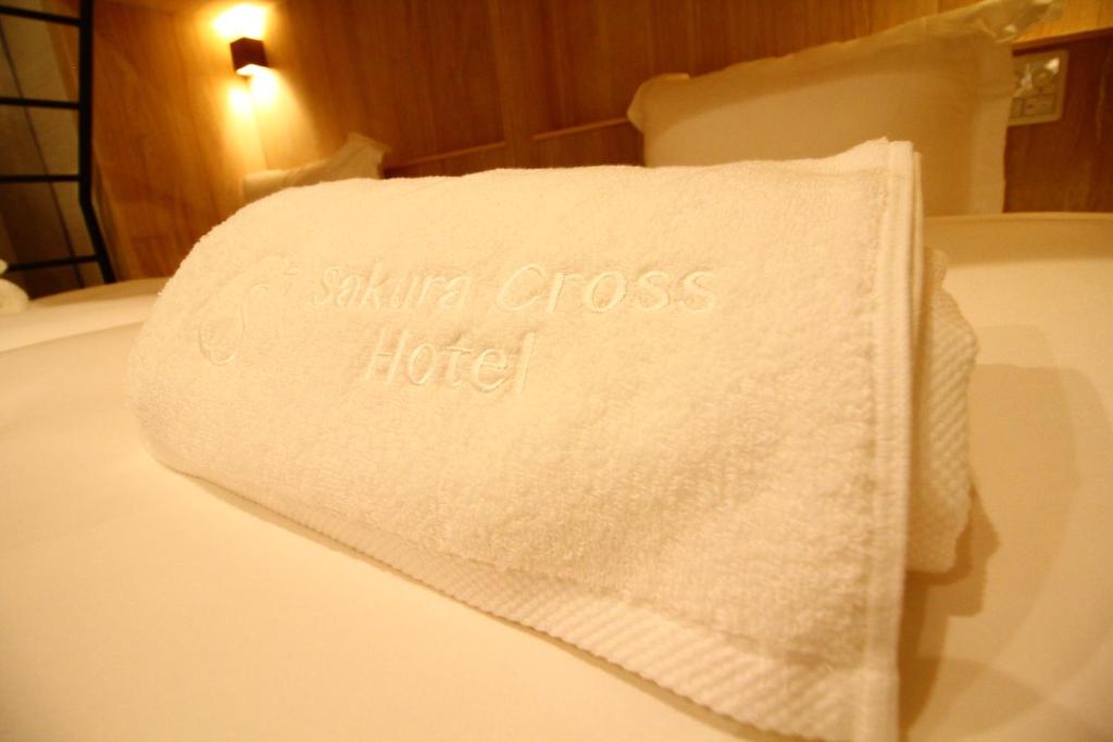 Postel nebo postele na pokoji v ubytování Sakura Cross Hotel Shinjuku East