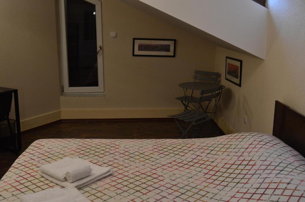 Una cama o camas en una habitación de Apartments Qualitas