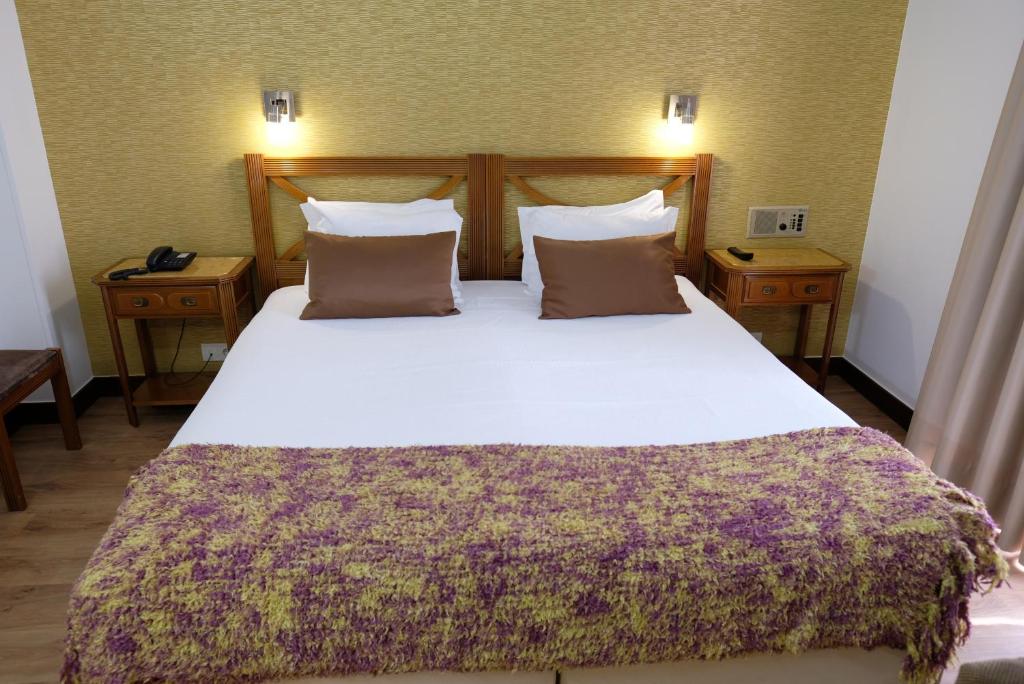 Postel nebo postele na pokoji v ubytování Hotel Dona Sofia