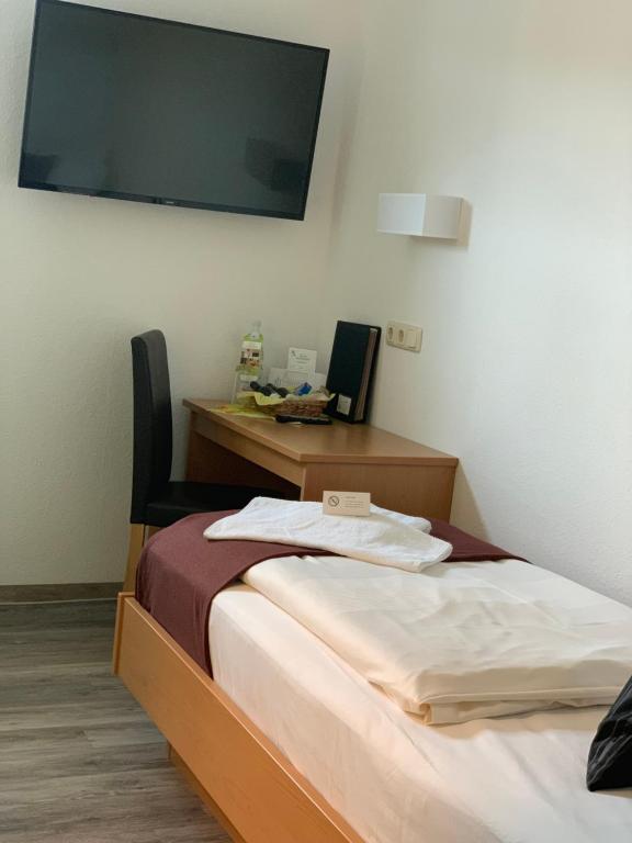 Postel nebo postele na pokoji v ubytování Hotel Bannewitz B&B