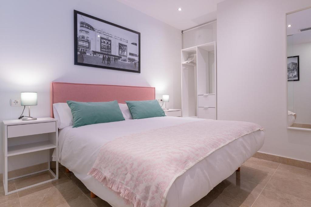 Posteľ alebo postele v izbe v ubytovaní Apartamentos Miraflores