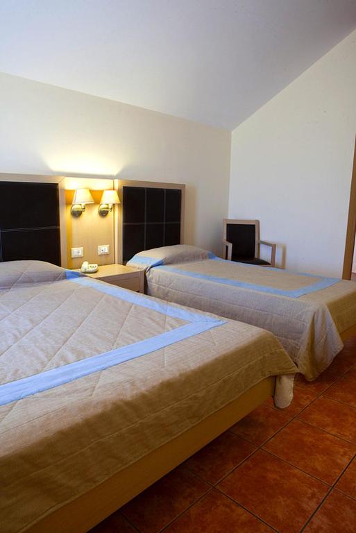 Postel nebo postele na pokoji v ubytování Lassi Hotel
